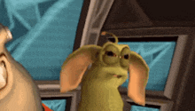 a cartoon character with big ears is standing next to a man