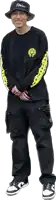a man wearing a black shirt and a hat with shin on it