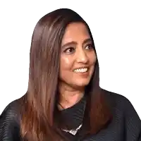 a woman with long brown hair is smiling and wearing a necklace