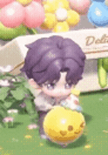 a little boy with purple hair is playing with a yellow balloon .