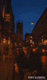 a pixelated image of a woman with the name tom slemen at the top
