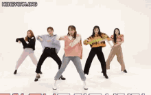 a group of women are dancing in front of a white background with the words honeycam.org written on the bottom