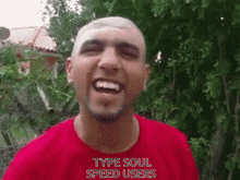 a man wearing a red shirt with the words type soul speed users on it