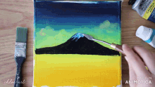 a painting of a mountain is being painted with a spatula