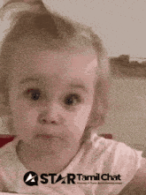 a little girl with a star tamil chat logo on the bottom right