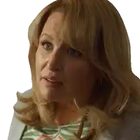 a close up of a woman 's face with a gray background