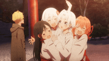a group of anime characters are posing for a picture with a man in the background