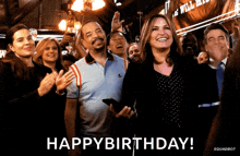 a group of people are celebrating a birthday with the words happy birthday in the corner
