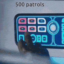 a person pressing a button on a cell phone with the words 500 patrols above it