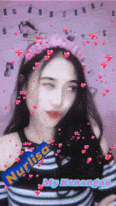 a girl wearing a headband with the name nurlisa on the bottom