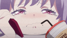 a girl is crying while holding a cup of coffee