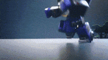 a purple robot is walking on a table in a dark room .