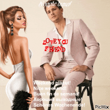 a man in a suit sits next to a woman in a white dress on a picmix page