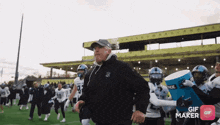 a gif maker shows a football player wearing a number 10 jersey