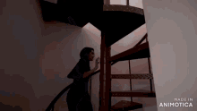 a woman is walking up a spiral staircase made in animotica
