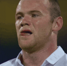 a close up of a man 's face with sweat on his face