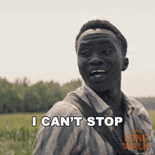 a man says " i can 't stop " in front of a poster for the long walk