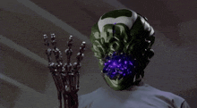 a robot with a purple light coming out of it 's face