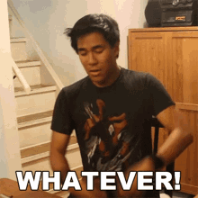 a man in a black t-shirt says whatever