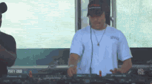a man in a white t-shirt with the word sony on it is playing music