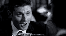a man in a suit and tie is saying i 've been re-hymnated .