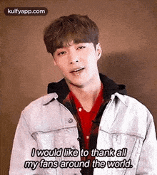 a young man in a denim jacket is talking to his fans around the world .