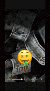 a smiley face with a dollar sign on its tongue
