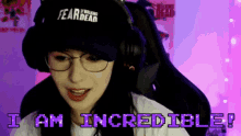 a woman wearing a fear of the walking dead hat and headphones says i am incredible
