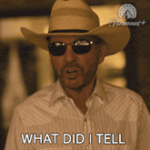 a man with a cowboy hat and sunglasses says what did i tell