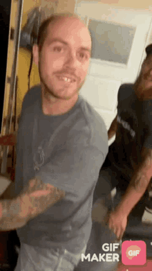 a man is dancing in a room with a gif maker app on his phone