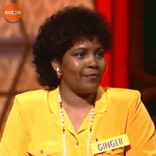 a woman with a name tag that says ginger on it