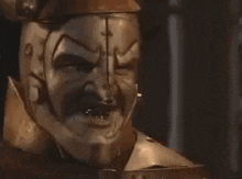 a close up of a statue of a man wearing a helmet .
