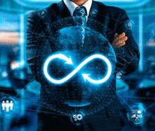 a man in a suit and tie holds an infinity symbol in his hands