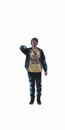 a man wearing a blue jacket and a yellow shirt stands with his arms outstretched