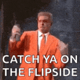 a man in an orange suit and tie is saying `` catch ya on the flipside '' while holding a stick .