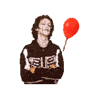 a man in a skeleton sweatshirt holds a red balloon
