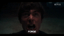a close up of a man 's face with his mouth open and the word forge written on it .