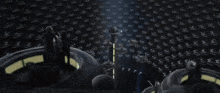 a group of people are standing in a room with a glowing figure in the middle of the room .