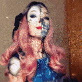 a woman with half of her face painted with a skull