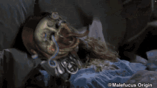 a drawing of a monster laying on a bed with the caption malefucus origin