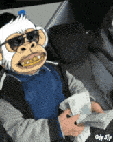 a monkey with gold teeth is holding a bunch of money in his hands