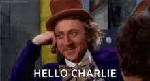 a man in a top hat and bow tie is talking to another man and says `` hello charlie '' .