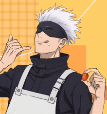 a man wearing an apron is holding a strawberry