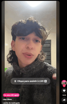 a screen shot of a man with a live d button in the corner