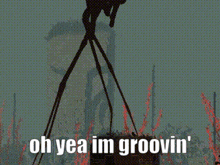 a silhouette of a monster with the words oh yea im groovin ' on it .