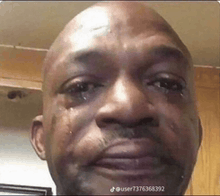 a man is crying with tears coming out of his eyes .