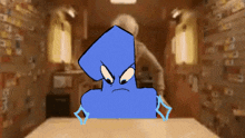 a blue cartoon character is sitting at a table in a dark room