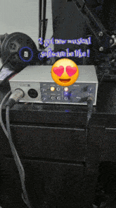 a smiley face with hearts in its eyes is on top of a volt recording device