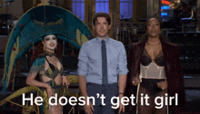 a man and two women standing next to each other with the words he does n't get it girl