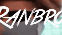 a close up of a person 's face with the word ranbro written in white
